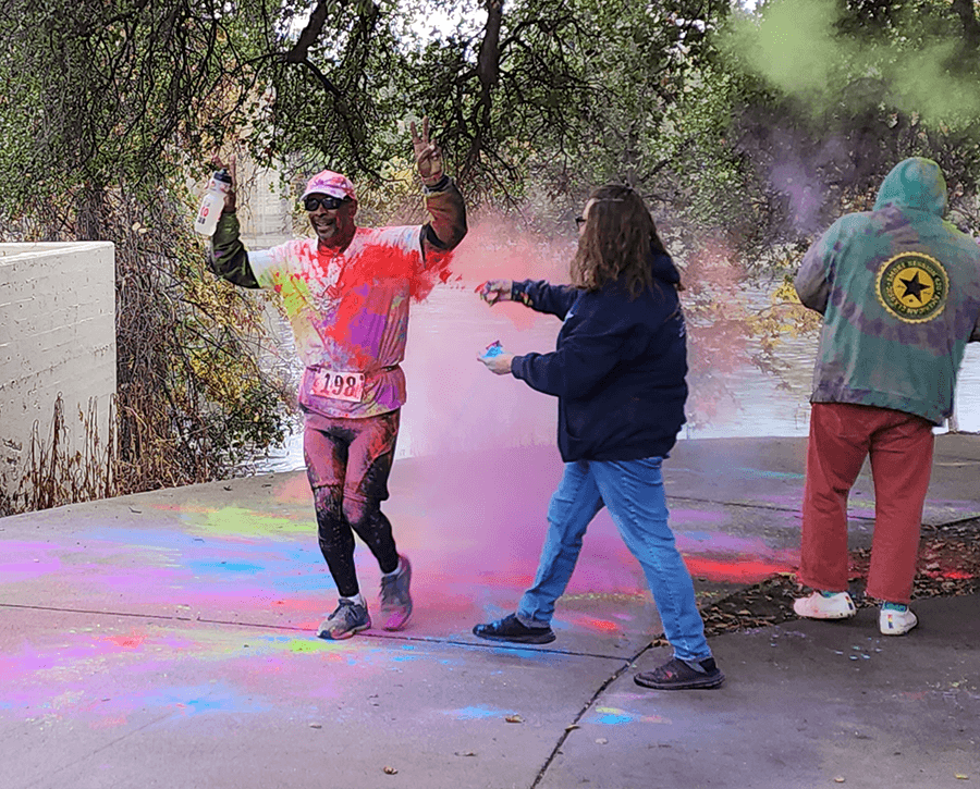 Man gets sprayed with color at the Nation's Finest 5K Color Run in Redding, CA