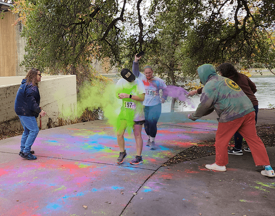Racers get sprayed with color at the Anniversary 5K in Redding, CA